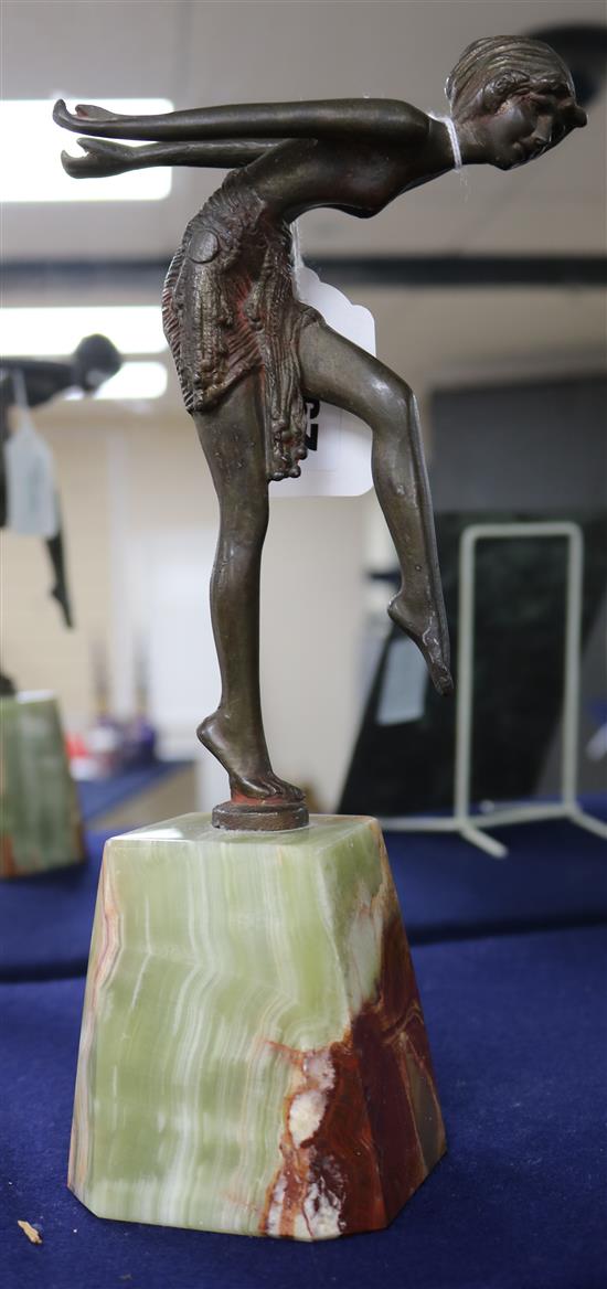 An Art Deco cold-painted bronze figure of a semi-nude Egyptian dancer, on onyx pedestal,